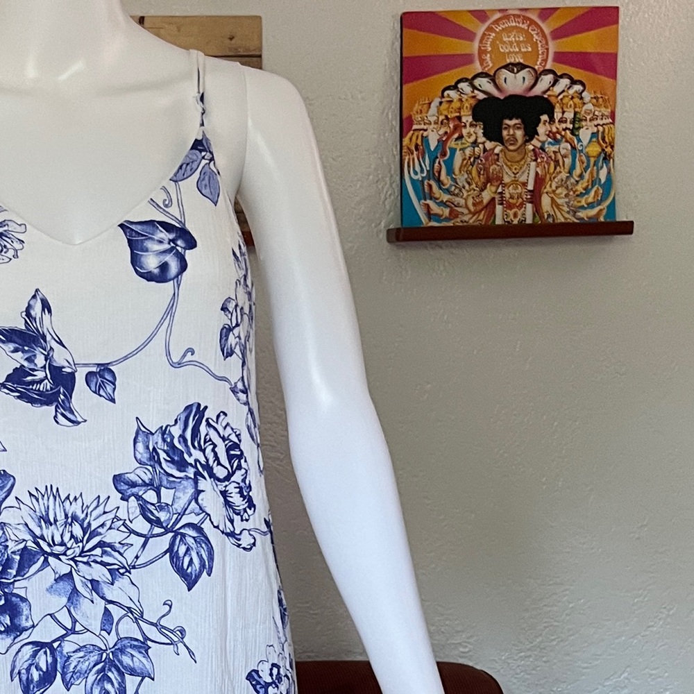 Swing/babydoll dress with an adorable blue and white floral  design throughout